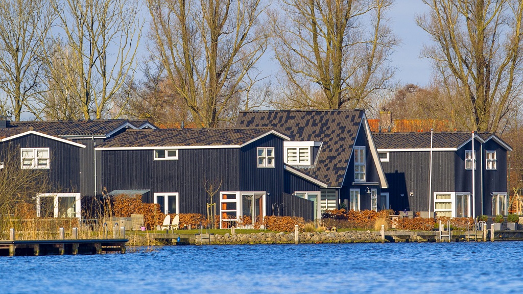 black houses by the water